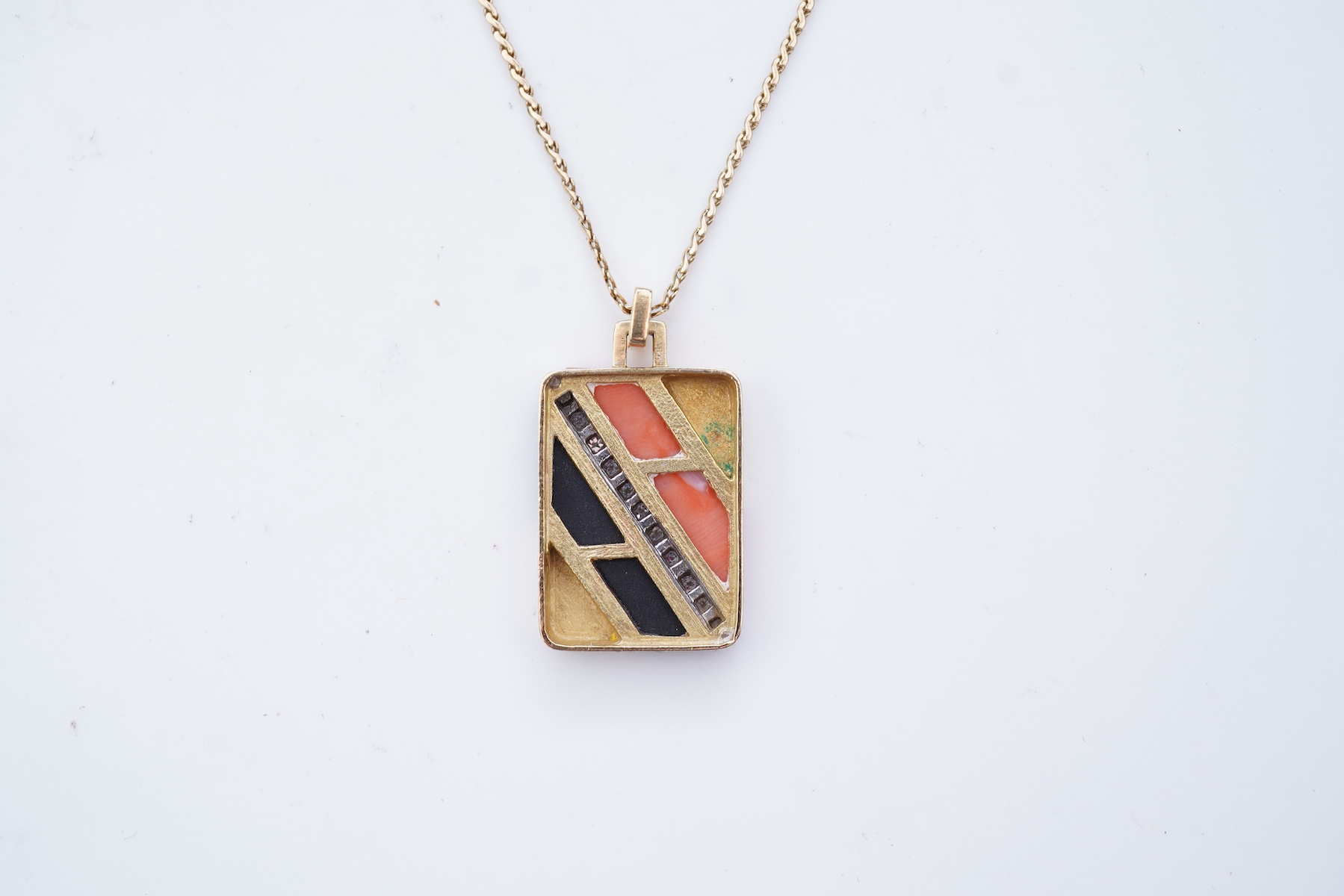 An onyx, coral and diamond demi-parure, circa 1976-7